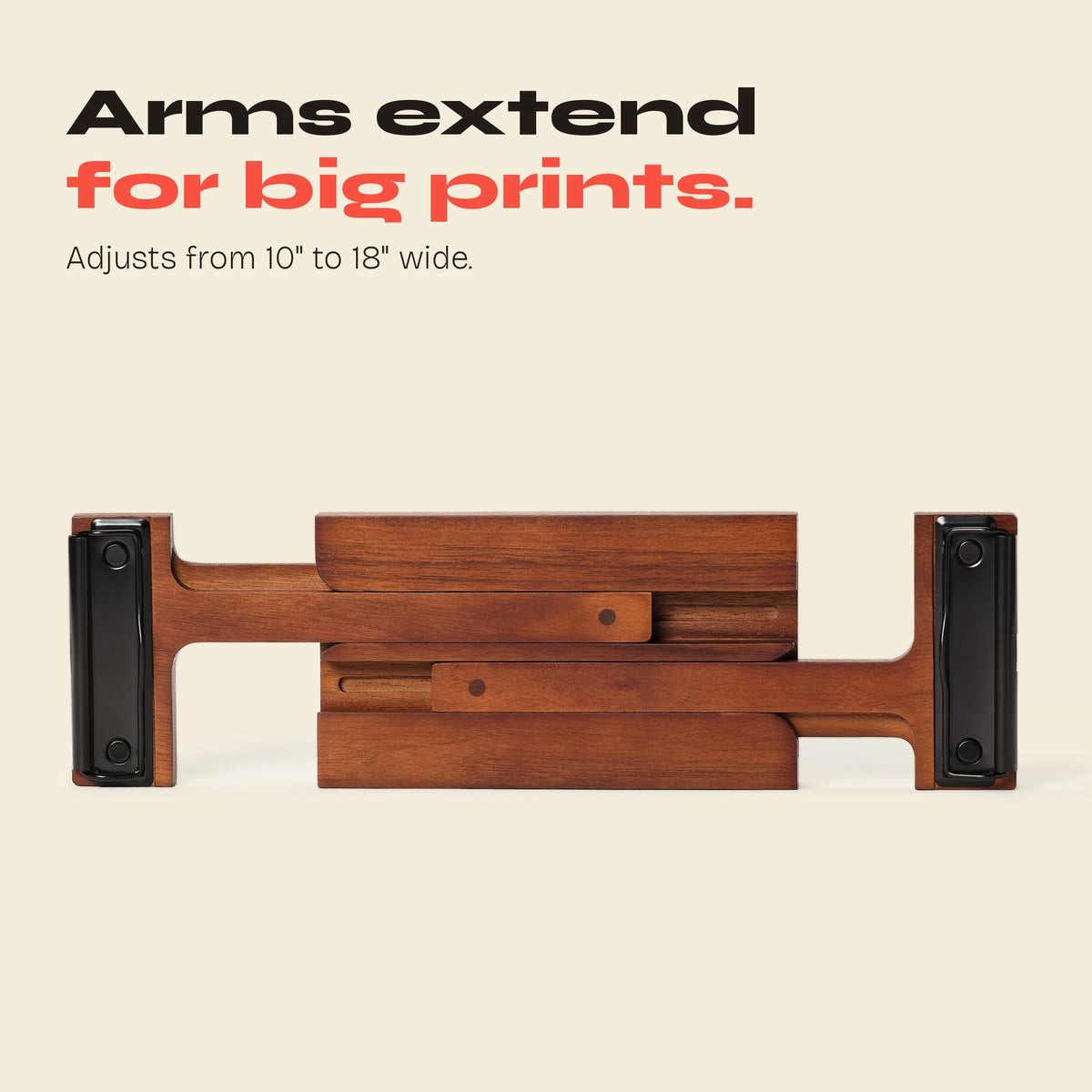 FORMA magazine display with black clips and arms extended for larger prints