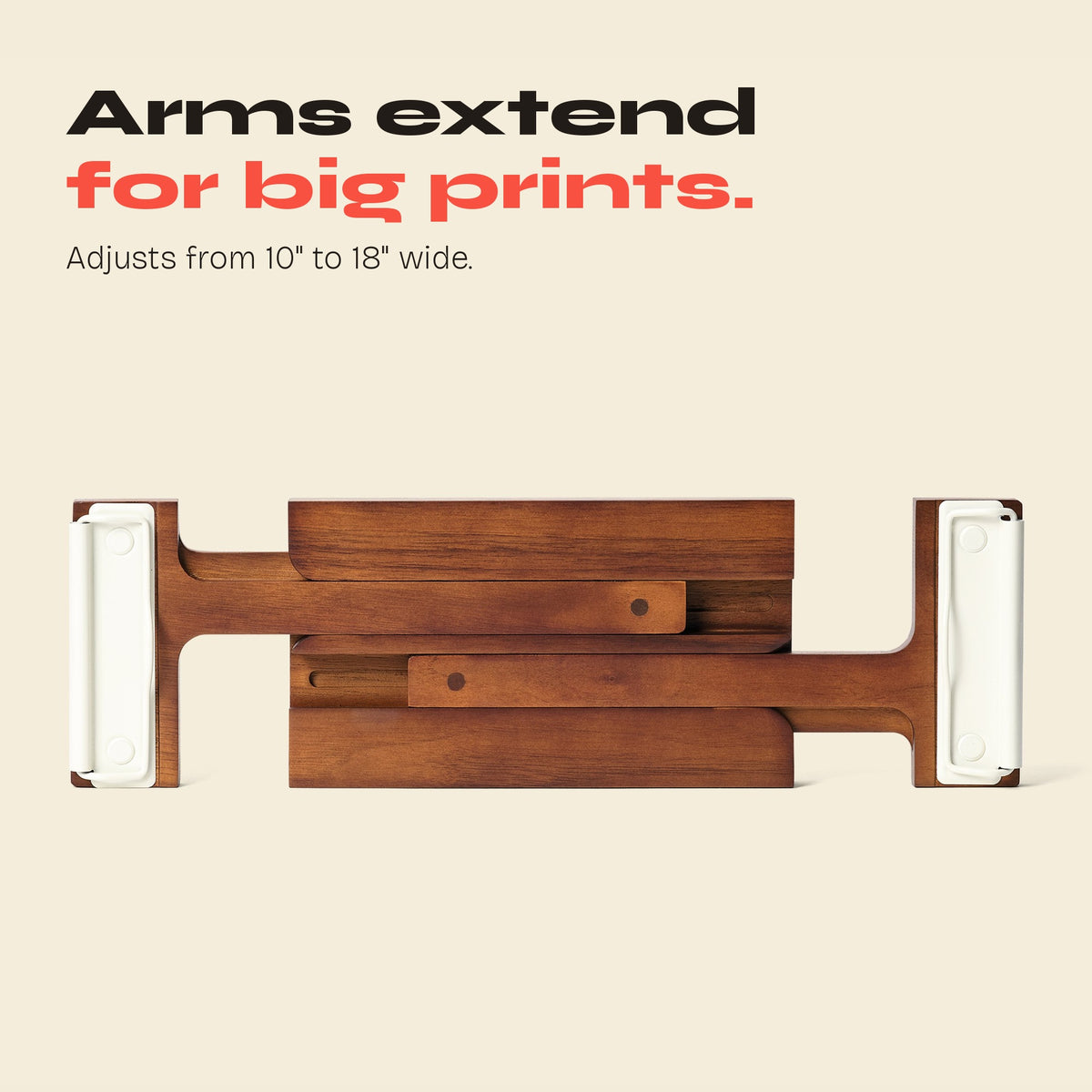 FORMA magazine display with white clips and arms extended for larger prints