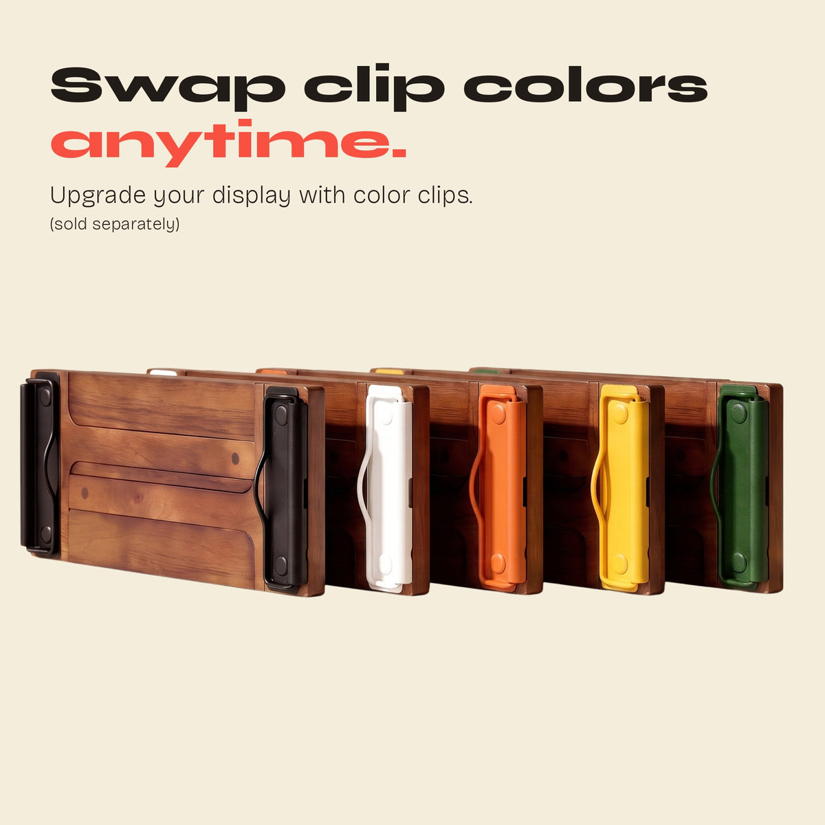 Row of FORMA displays with black, white, orange, yellow and green clips, color clips sold separately